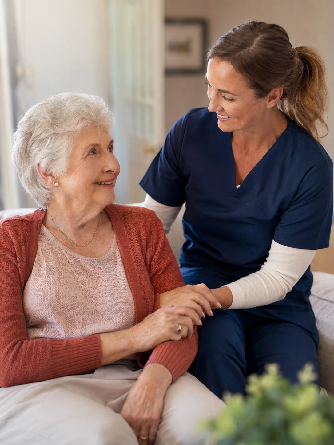 Guardian Nursing Agency care worker offering companionship and emotional support to an older woman at home as a caring aged care service provider